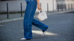 Jacqueline Zelwis is seen wearing 7 for all mankind x Marques Almeida denim jacket, white cropped top Zara, Levi's jeans, AGL shoes, Furla bag on June 02, 2021 in Berlin, Germany. 