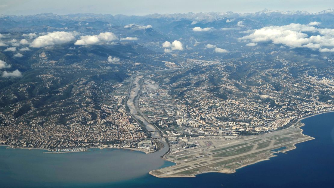 TOPSHOT - This aerial photograph taken on October 20, 2020 shows the Nice Cote d'Azur airport and the mud stream of the Var river carried from the inland into the Mediterrenean sea, following heavy rains brought by storm Alex. - Heavy rains and brutal floods have left villages cut off from the world in the Alpes Maritimes, where hundreds of fire-fighters have been mobilised on October 3, to find nine missing persons. (Photo by Valery HACHE / AFP) (Photo by VALERY HACHE/AFP via Getty Images)