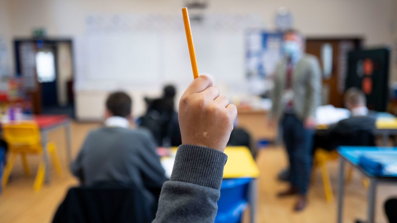 A pupil's hand is raised during a lesson at Whitchurch High School on September 14, 2021 in Cardiff, Wales.