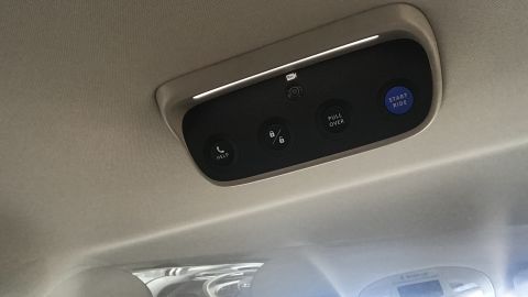 Riders on Waymo can hit buttons in the van's cabin to start and end their ride.