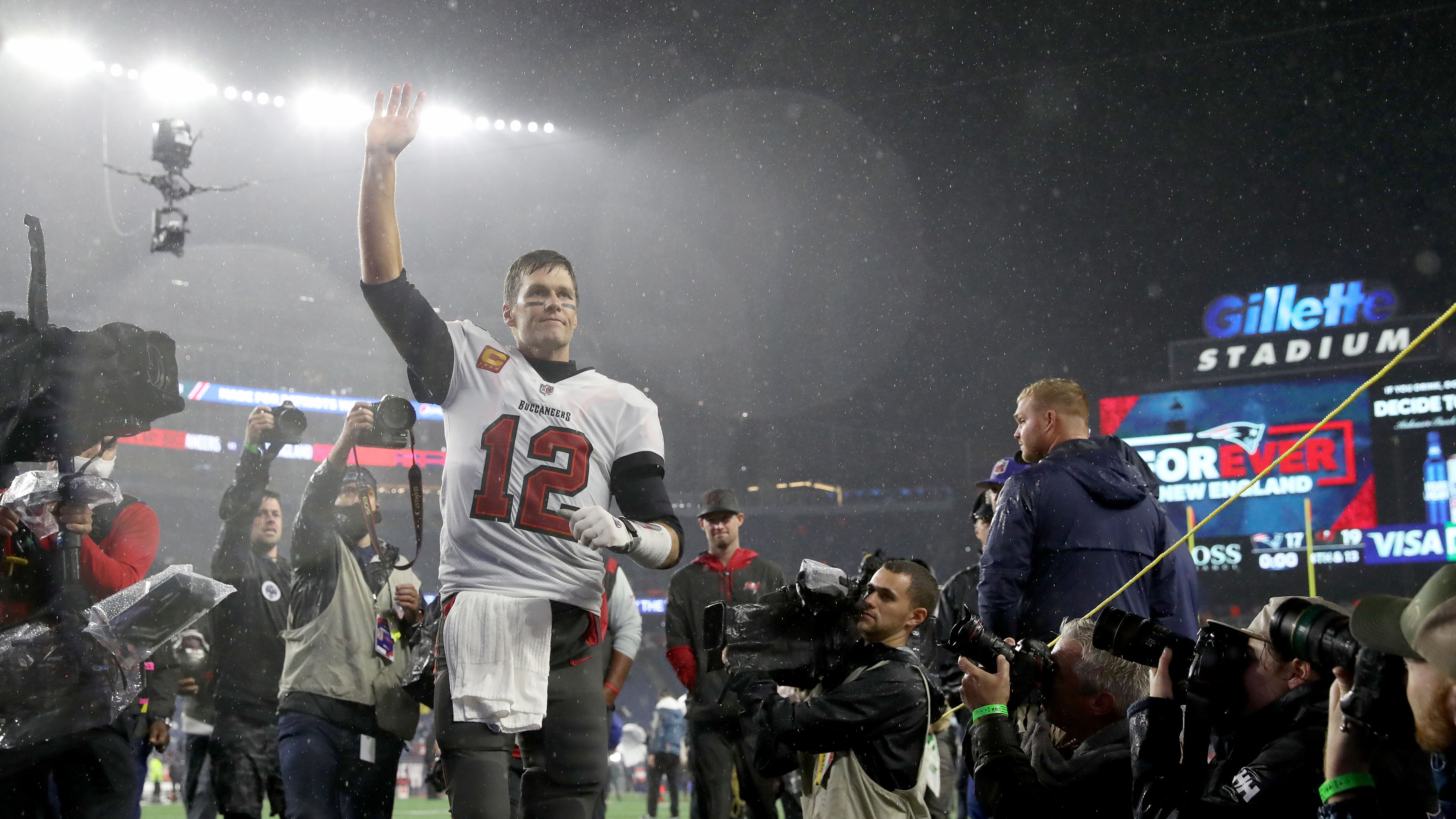 Brady runs off the field after the Buccaneers defeated his former team, the New England Patriots, in October 2021. It was <a href="index.php?page=&url=https%3A%2F%2Fwww.cnn.com%2F2021%2F10%2F04%2Fsport%2Ftom-brady-new-england-patriots-return-spt-intl%2Findex.html" target="_blank">Brady's first game back in New England</a> since he left the franchise in 2020.