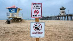 HUNTINGTON BEACH, CA - OCTOBER 07: A sign posted in the sand just south of the Huntington Beach Pier lets beach goers know that the shoreline and water are closed due to the offshore oil spill last weekend, as hundreds of crews continue cleaning Huntington Beach and Newport Beach on Thursday, October 7, 2021. (Photo by Mark Rightmire/MediaNews Group/Orange County Register via Getty Images)