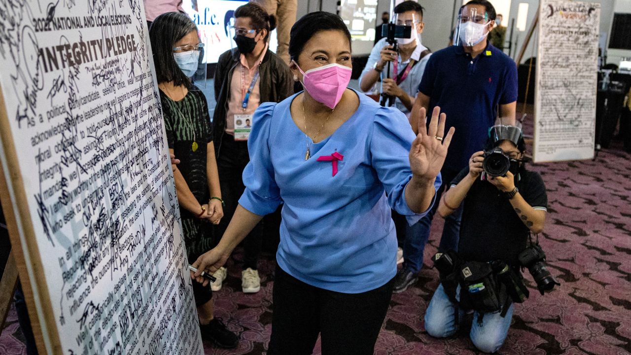 Philippine Vice President Leni Robredo gestures after filing her candidacy to join the 2022 presidential race in Pasay, Metro Manila on October 7.