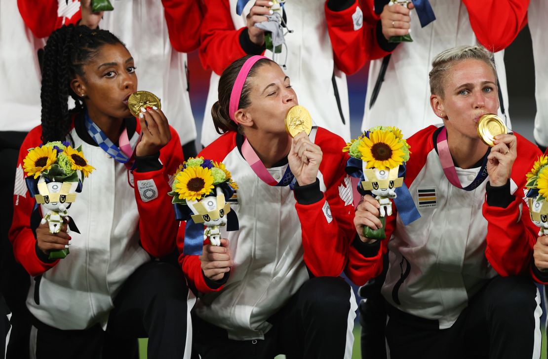 Labbe kisses her Olympic gold medal, Canada's first ever in women's soccer.
