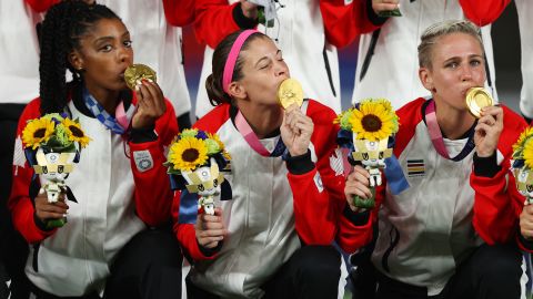 Labbe kisses her Olympic gold medal, Canada's first ever in women's soccer.