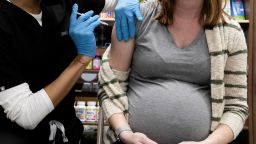 A pregnant woman receives a vaccine for the coronavirus disease (COVID-19) at Skippack Pharmacy in Schwenksville, Pennsylvania, U.S., February 11, 2021. 