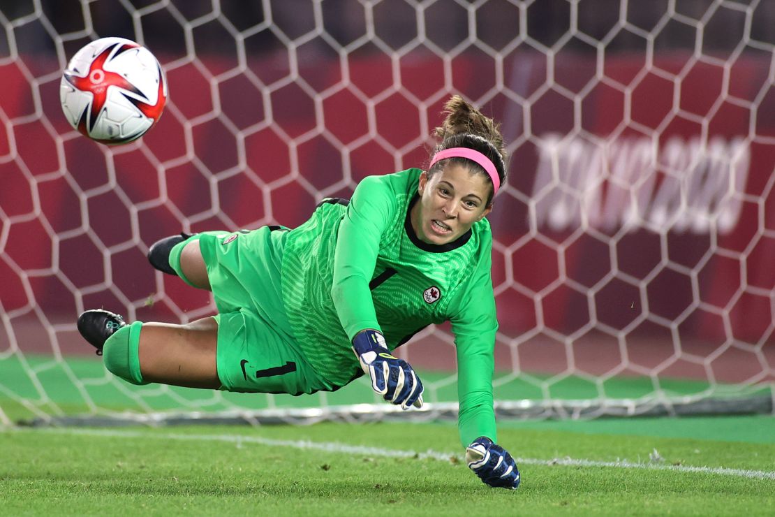 Canada's Stephanie Labbe saves Brazilian Rafaelle's penalty during the women's quarterfinal shootout at the Tokyo Olympics.