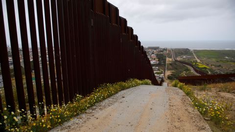 Sections of the steel bollard-style border wall stands along the US-Mexico border between San Diego and Tijuana on May 10, 2021 in the Otay Mesa area of San Diego County, California. 