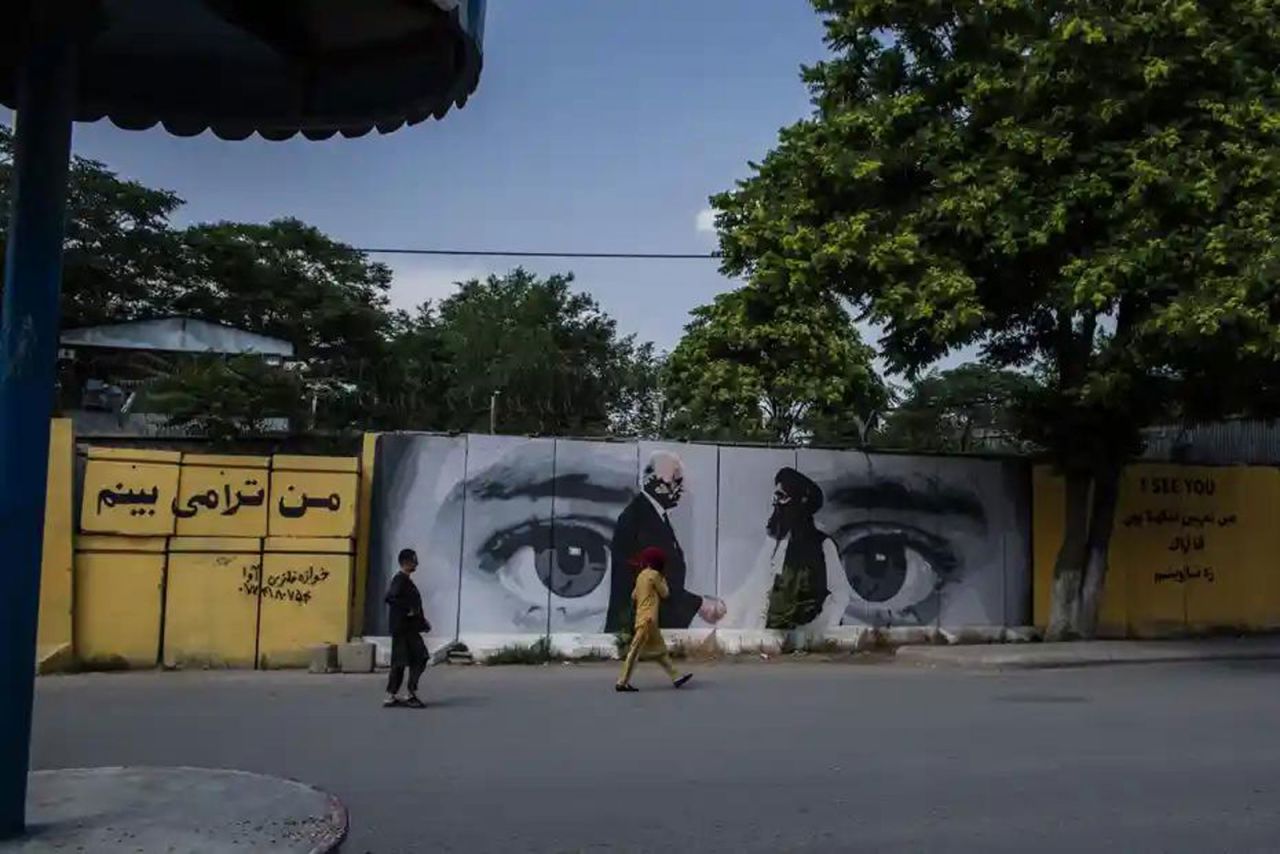 A mural in Kabul that depicted the US-Taliban peace agreement in Doha has been painted over and replaced with black-and-white text.
