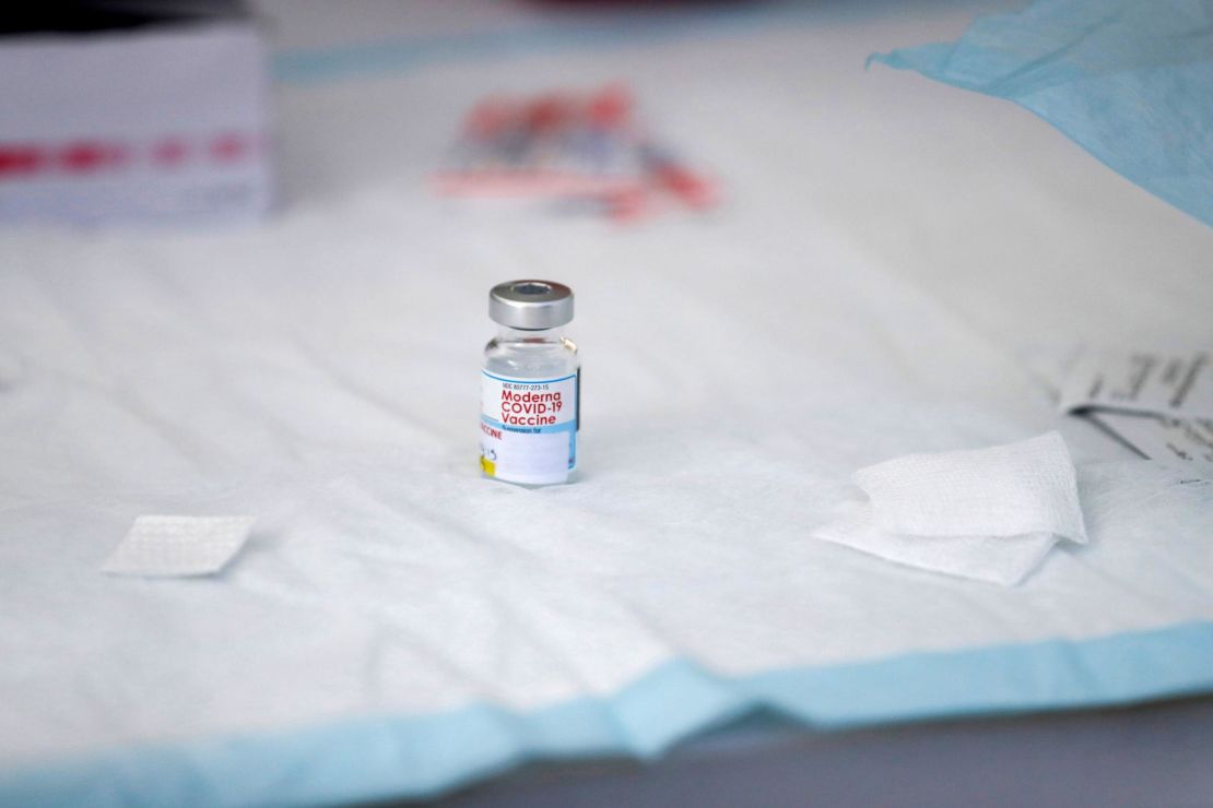 A vial containing Moderna Covid-19 vaccine sits on a table at a clinic for individuals experiencing homelessness at San Julian Park in Los Angeles, California.