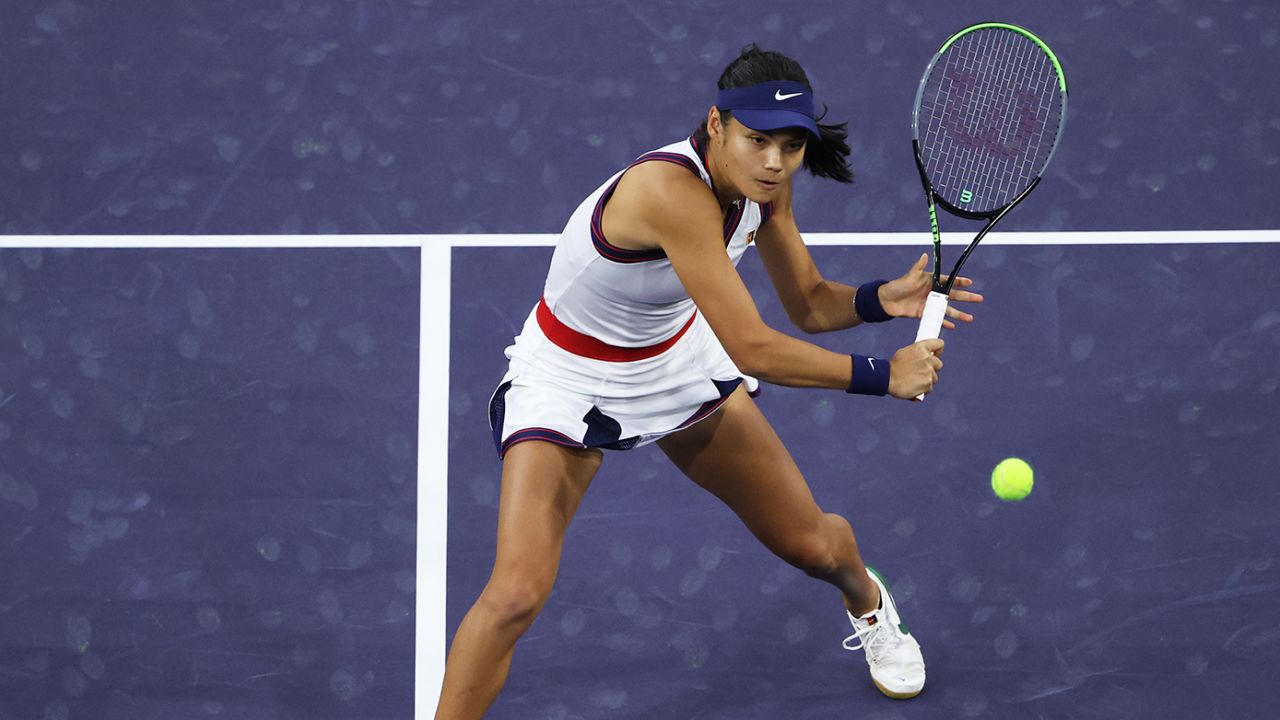 Raducanu plays a backhand volley against Sasnovich.