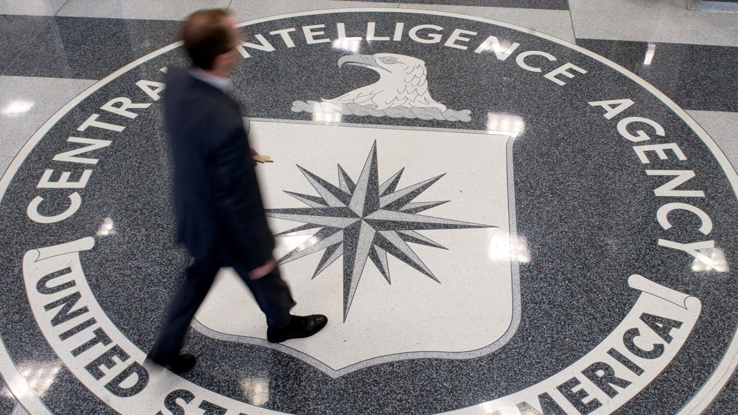 A man crosses the Central Intelligence Agency (CIA) seal in the lobby of CIA Headquarters in Langley, Virginia, on August 14, 2008. AFP PHOTO/SAUL LOEB (Photo by SAUL LOEB / AFP) (Photo by SAUL LOEB/AFP via Getty Images)