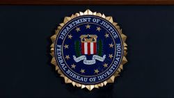 FILE - In this June 14, 2018, file photo, the FBI seal is seen before a news conference at FBI headquarters in Washington.