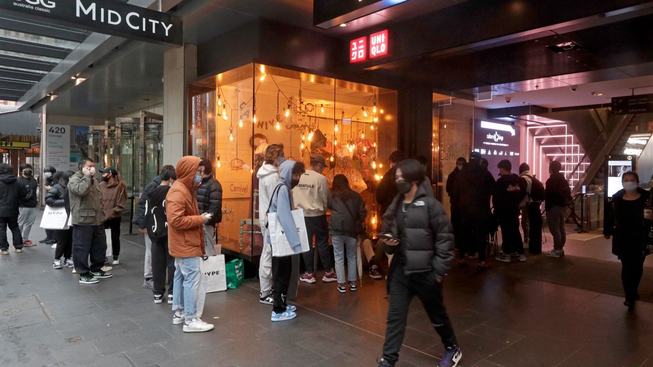 Customers line up to enter a store in Sydney on October 11 after more than 100 days of lockdown.