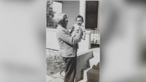 Young Wah Gok holds his granddaughter Connie Young Yu.
