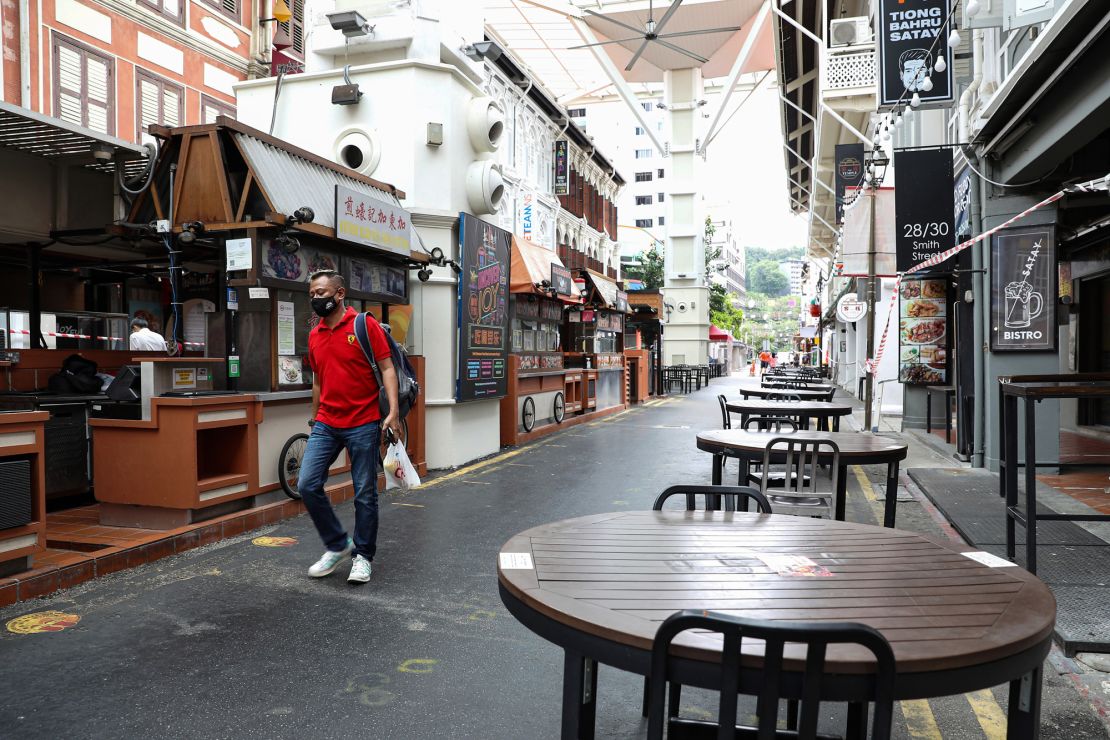 Empty tables and closed restaurants seen in Chinatown, Singapore on October 5.