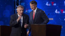 Virginia Democratic gubernatorial candidate and former Gov. Terry McAuliffe, left, and Republican challenger, Glenn Youngkin, walk off the stage after a debate at Northern Virginia Community College, in Alexandria, Va., on, Sept. 28, 2021. 