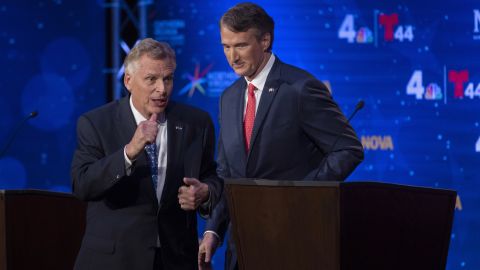 Virginia Democratic gubernatorial candidate and former Gov. Terry McAuliffe, left, and Republican challenger, Glenn Youngkin, walk off the stage after a debate at Northern Virginia Community College, in Alexandria, Va., on, Sept. 28, 2021.