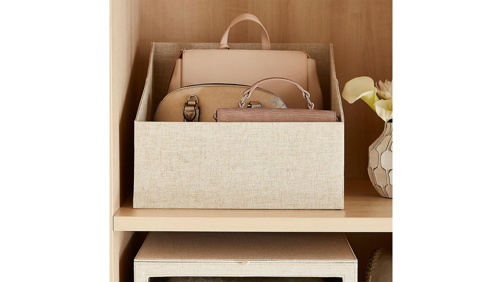 Organizing purses and bags can be difficult. Lining them up on shelves and  using bookends will keep them standing up. @…