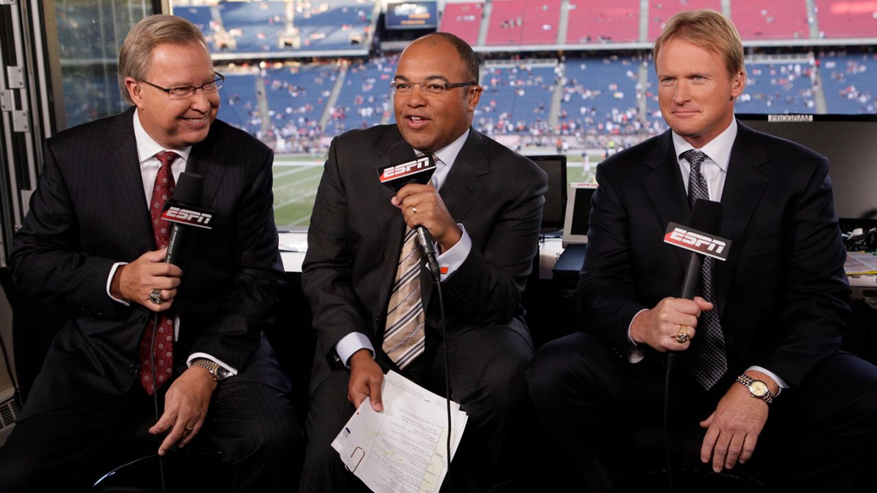 ESPN broadcasting crew Ron Jaworski, left, Mike Tirico, center, and Jon Gruden, right, before an NFL football game between the New England Patriots and the Buffalo Bills, Monday, Sept. 14, 2009, in Foxborough, Mass. (AP Photo/Steven Senne)