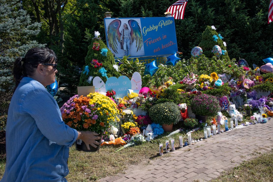 People leave flowers at a memorial site for Gabby Petito in Blue Point, New York, on  September 26.