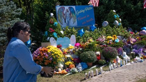 People leave flowers at a memorial site for Gabby Petito in Blue Point, New York, on  September 26.