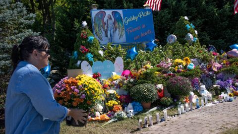 People leave flowers at a memorial site for Gabby Petito in Blue Point, New York, on September 26.