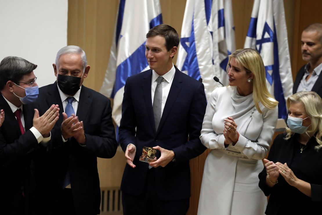 Israeli legislator Ofir Akunis (first from left) presents Jared Kushner with a gift as Ivanka Trump, Benjamin Netanyahu and Sara Netanyahu look on.