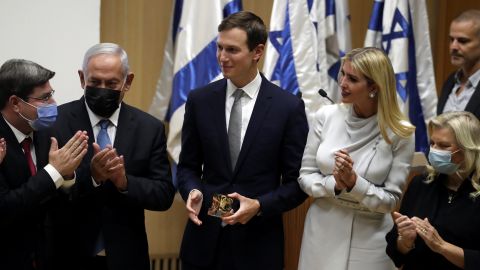 Israeli legislator Ofir Akunis (first from left) presents Jared Kushner with a gift as Ivanka Trump, Benjamin Netanyahu and Sara Netanyahu look on.