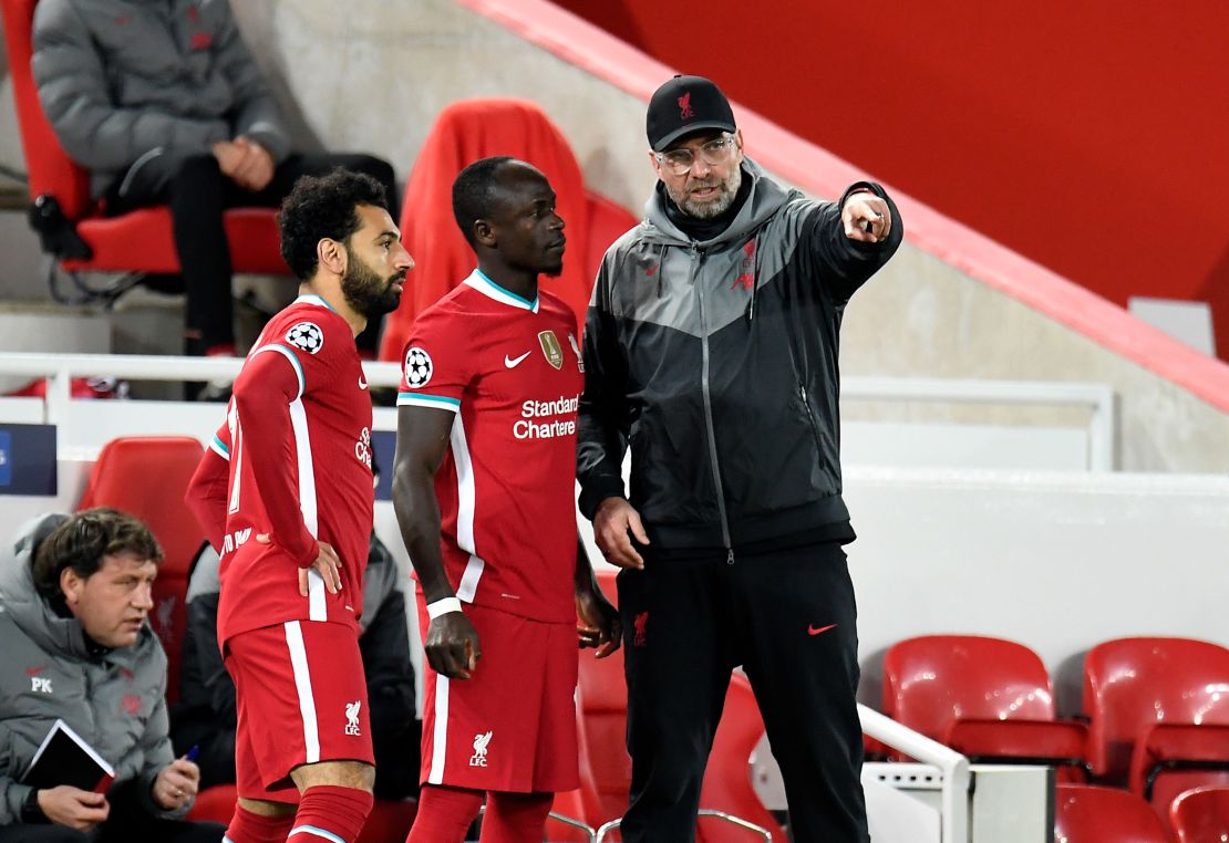 Salah and Sadio Mane receive instructions from Liverpool manager Jurgen Klopp.