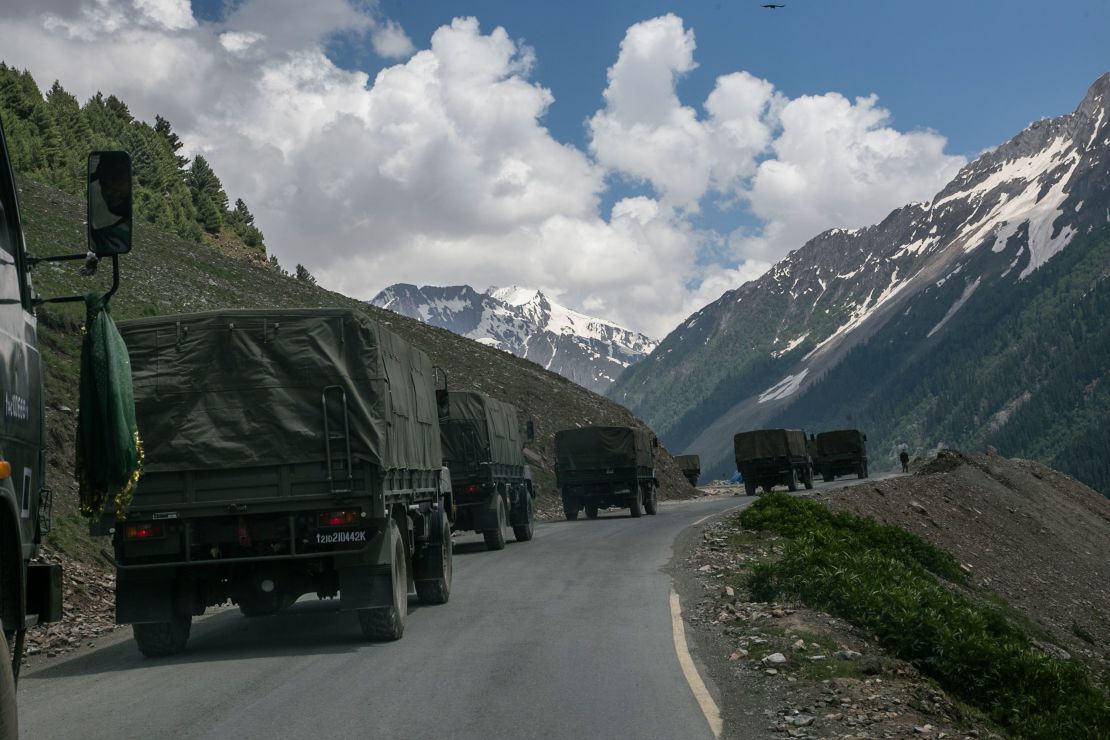 An Indian army convoy travels through Zoji La, a high mountain pass bordering China on June 13 in Ladakh, India.