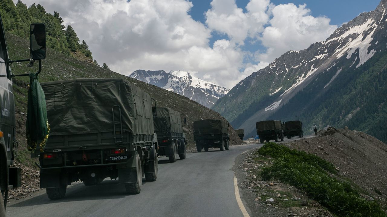 An Indian army convoy travels through Zoji La, a high mountain pass bordering China on June 13 in Ladakh, India.