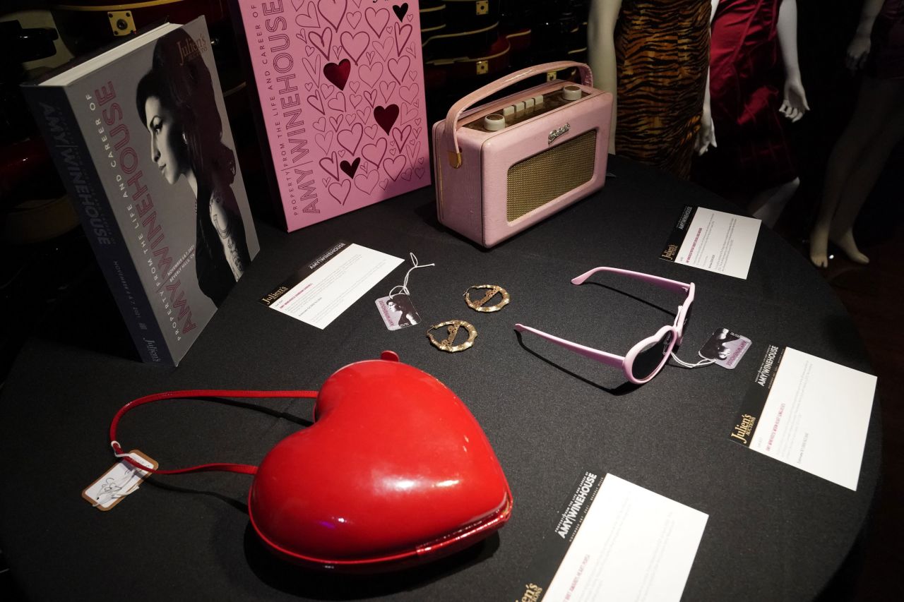 Accessories including earrings, heart-shaped sunglasses and purse are among the items up for auction.