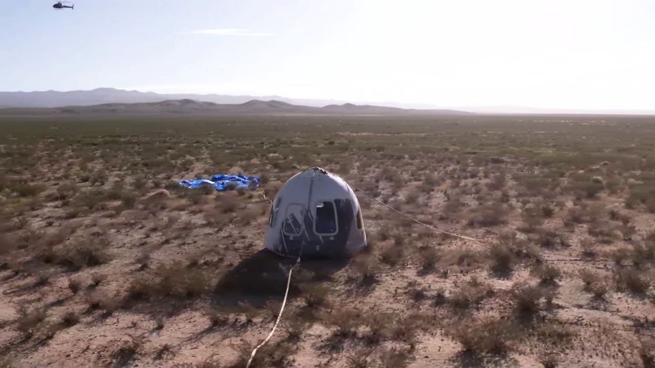 The Blue Origin capsule, with Shatner inside, waits for recovery crews after landing in the Texas desert.