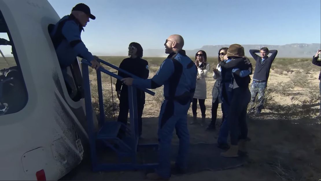 Actor William Shatner is greeted by Blue Origin CEO Jeff Bezos after emerging from the space capsule.