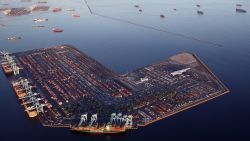 Container ships (Top R) are anchored by the ports of Long Beach and Los Angeles as they wait to offload on September 20, 2021 near Los Angeles, California.