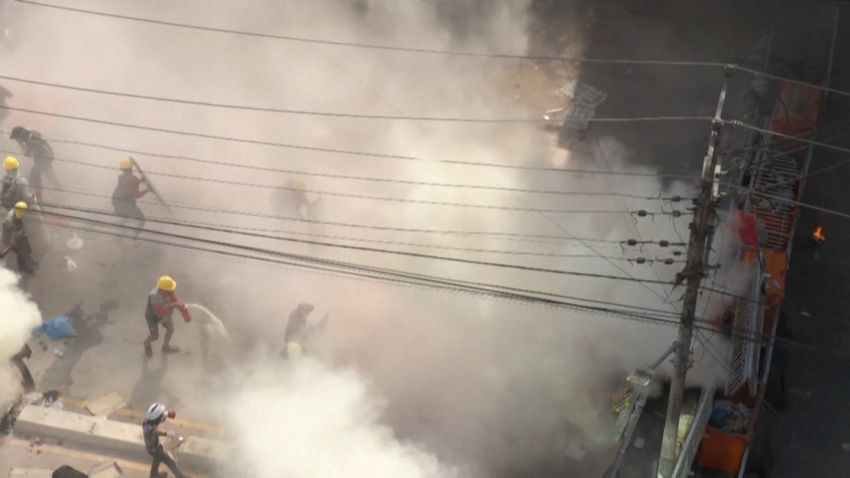 screengrab myanmar protest crowd tear gas