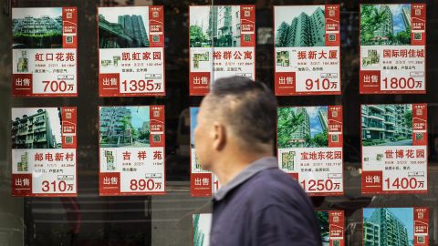 Listings of apartments for sale displayed at a real estate office in Shanghai, China, on Monday, Aug. 30, 2021. 