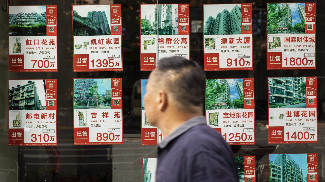 Listings of apartments for sale displayed at a real estate office in Shanghai, China, on Monday, Aug. 30, 2021.