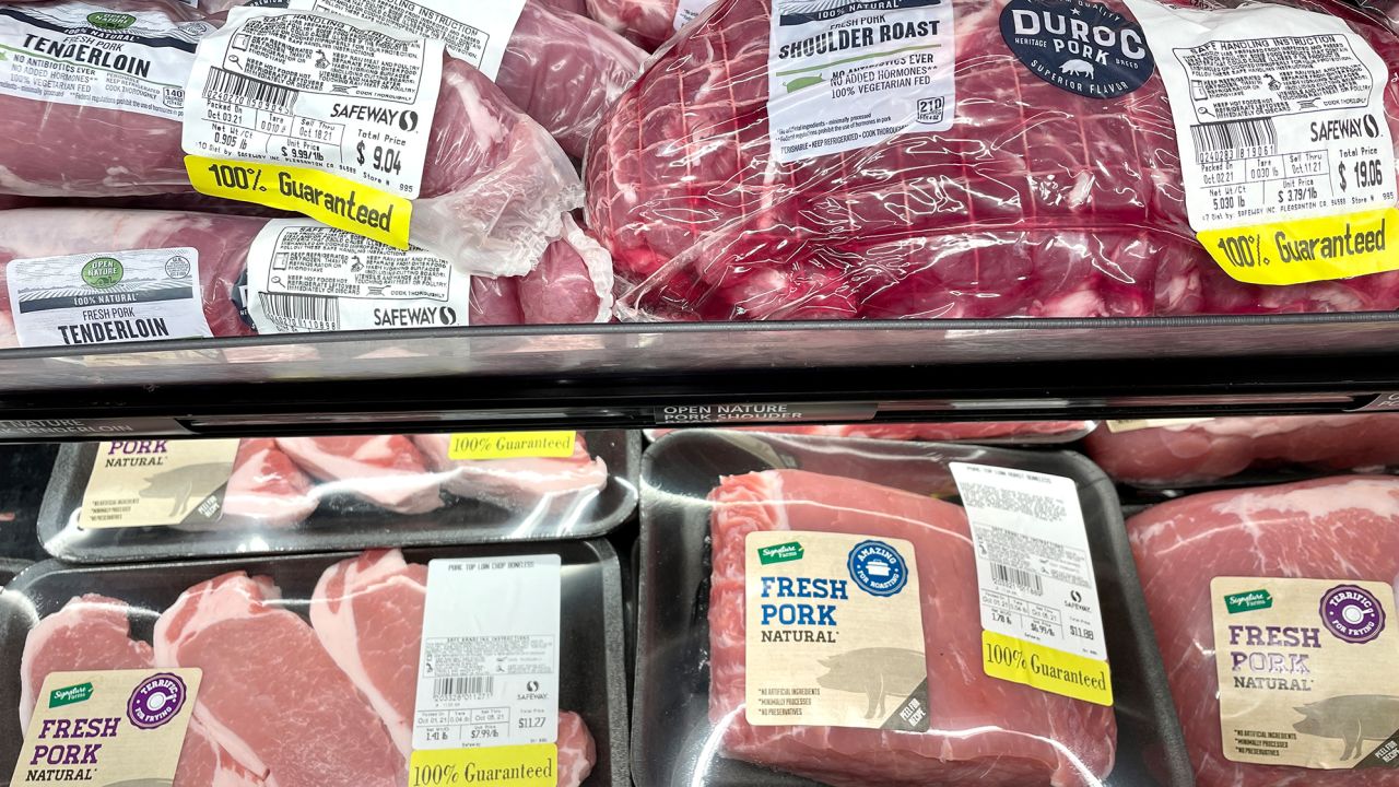 Pork products are displayed on a shelf at a Safeway in San Francisco. The price for meat has surged over the past year due to supply chain issues, inflation and Covid. 