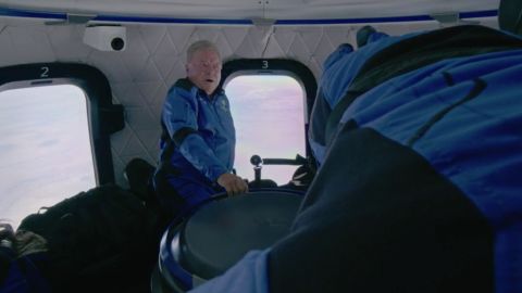 William Shatner and the NS-18 crew inside the capsule, floating around.
