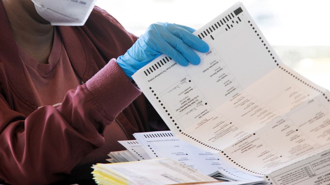 ATLANTA, GA - NOVEMBER 04: An election worker counts Fulton County ballots at State Farm Arena on November 4, 2020 in Atlanta, Georgia. The 2020 presidential race between incumbent U.S. President Donald Trump and Democratic nominee Joe Biden is still too close to call with outstanding ballots to count. (Photo by Jessica McGowan/Getty Images)