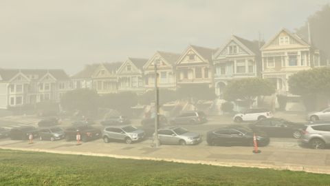 ThisClimateDoesNotExist uses AI to show how places might look due to climate change; here, a Google Street View image of San Francisco's "Painted Ladies" homes are depicted by the tech as shrouded in smog.
