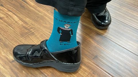 A nurse at Houston Women's Reproductive Services shows off her socks, honoring the late Justice Ruth Bader Ginsberg.