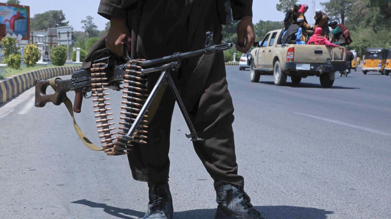 A Taliban fighter stands guard on a street in Herat on August 14, 2021.