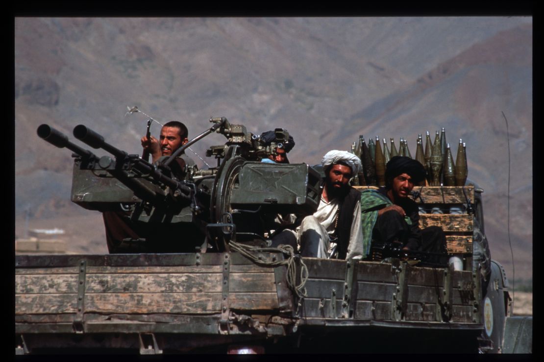 Taliban militiamen ride in a heavily armed vehicle October 10, 1996 in Kabul, Afghanistan.