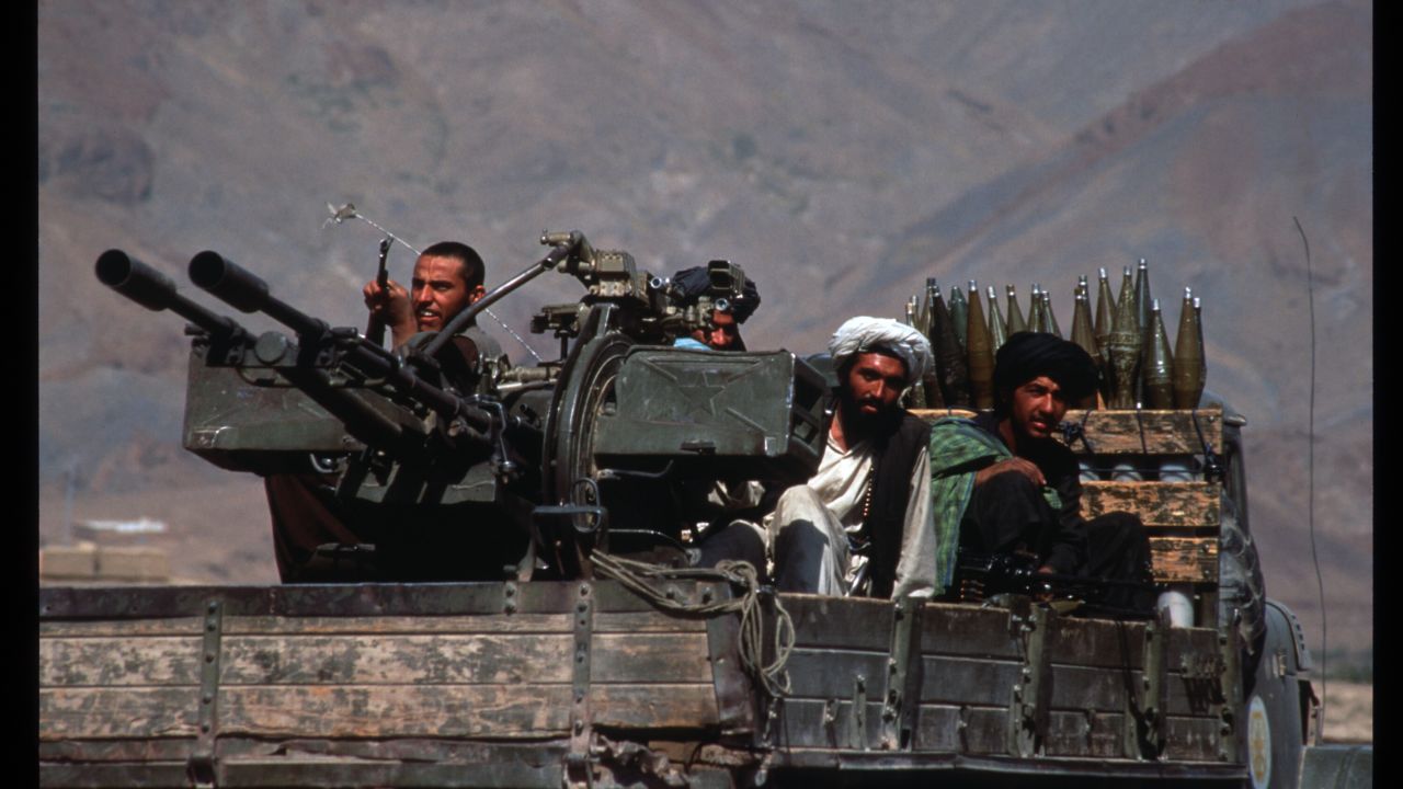 Taliban militiamen ride in a heavily armed vehicle October 10, 1996 in Kabul, Afghanistan.