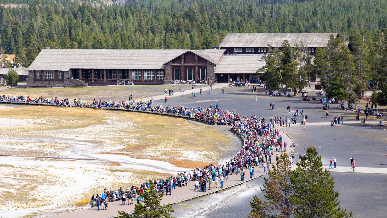 Crowds gather for an afternoon Old Faithful geyser eruption in September 2021. Jacob W. Frank/NPS