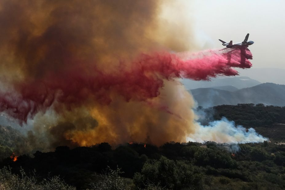 An air tanker drops retardant on a wildfire in Goleta. 