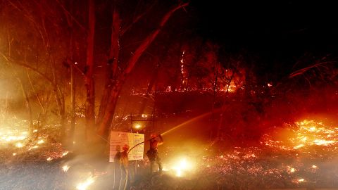 Firefighters battle the Alisal Fire along the 101 Freeway near Goleta, California, on Tuesday. 